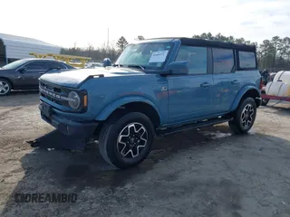 2022 Ford Bronco z VIN 1FMDE5DH0NLB77892, wystawiony jako IAAI lot #41466172 z przebiegiem 38 709 mil mil oraz . Historia ofert i sprzedaży dostępna na DreamBid. Obrazek 2.
