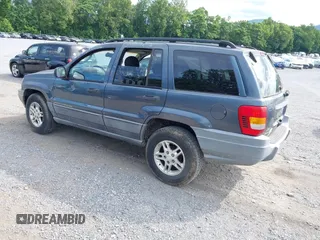 2002 Jeep Grand Cherokee Laredo with VIN 1J4GW48S92C150162, listed as a IAAI auction lot 42471732 with 171,677 mi miles and . Bid and sale history available at DreamBid. Image 3.