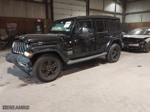 2019 Jeep Wrangler Unlimited Sahara with VIN 1C4HJXEG9KW579682, listed as a IAAI auction lot 41310472 with 74,265 mi miles. Bid and sale history available at carsss.com. Image 2.