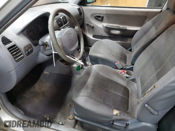 2002 Hyundai Accent with VIN KMHCF35G82U192732, listed as a Copart auction lot 85187074 with 224,194 mi miles and Clean title. Bid and sale history available at DreamBid. Image 7.