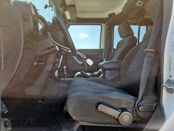 2012 Jeep Wrangler Unlimited Sport with VIN 1C4BJWDG9CL187421, listed as a Copart auction lot 61411145 with 140,390 mi miles and Clean title. Bid and sale history available at DreamBid. Image 7.