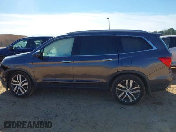 2017 Honda Pilot Touring with VIN 5FNYF5H92HB038893, listed as a IAAI auction lot 41639555 with 100,354 mi miles. Bid and sale history available at carsss.com. Image 14.