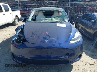 2025 Tesla Model Y Long Range with VIN 7SAYGDEEXSA346006, listed as a IAAI auction lot 41835610 with 1,896 mi miles and . Bid and sale history available at carsss.com. Image 12.