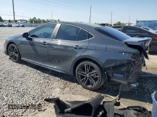 2025 Toyota Camry LE with VIN 4T1DAACK6SU559271, listed as a Copart auction lot 52409575 with 4,474 mi miles and Salvage Title. Bid and sale history available at carsss.com. Image 2.