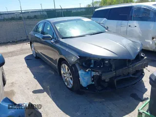 2015 Lincoln MKZ z VIN 3LN6L2G93FR607192, wystawiony jako IAAI lot #42226377 z przebiegiem 74 018 mil mil oraz . Historia ofert i sprzedaży dostępna na DreamBid. Obrazek 1.