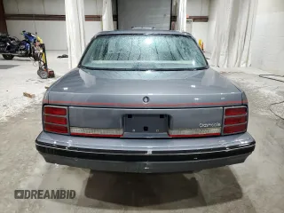 1991 Oldsmobile Cutlass Ciera with VIN 2G3AM54N8M2304905, listed as a Copart auction lot 52047535 with 28,749 mi miles and Salvage Title. Bid and sale history available at DreamBid. Image 6.