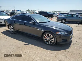 2013 Jaguar XJ with VIN SAJWA3HE9DMV49768, listed as a Copart auction lot 50339955 with 56,841 mi miles and Salvage Title. Bid and sale history available at DreamBid. Image 4.