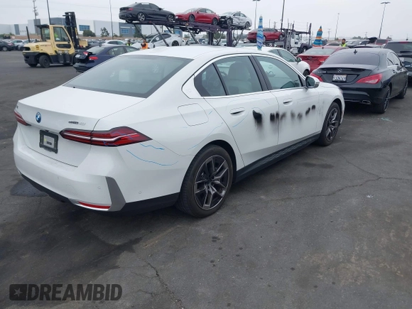 2024 BMW i5 eDrive40 with VIN WBY33FK03RCR99079, listed as a IAAI auction lot 42028540 with 28,827 mi miles and . Bid and sale history available at DreamBid. Image 4.