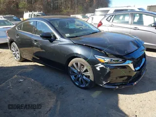 2018 Mazda 6 Grand Touring with VIN JM1GL1TY0J1319083, listed as a IAAI auction lot 40852818 with 57,408 mi miles and . Bid and sale history available at DreamBid. Image 1.