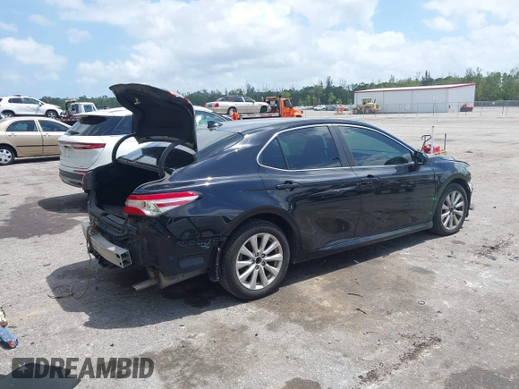 2020 Toyota Camry LE with VIN 4T1C11AK1LU986972, listed as a IAAI auction lot 41966639 with 97,617 mi miles and . Bid and sale history available at carsss.com. Image 4.