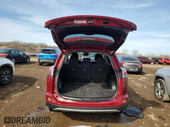 2018 Toyota RAV4 XLE with VIN 2T3RFREV0JW725903, listed as a Copart auction lot 48519955 with 55,056 mi miles and Salvage Title. Bid and sale history available at DreamBid. Image 6.