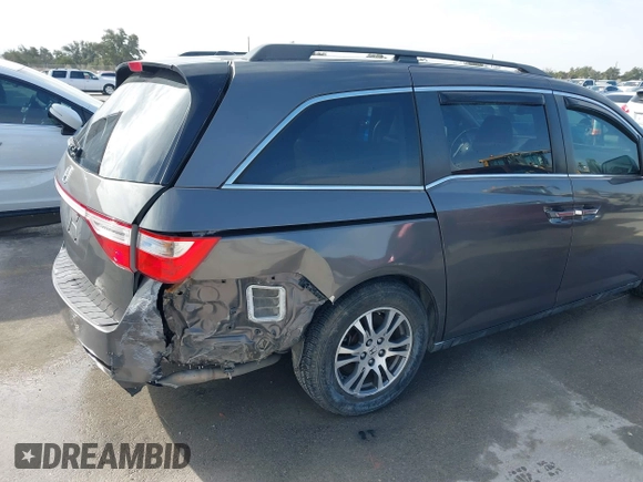 2012 Honda Odyssey EX-L with VIN 5FNRL5H60CB094682, listed as a IAAI auction lot 41570797 with 127,890 mi miles and . Bid and sale history available at carsss.com. Image 17.