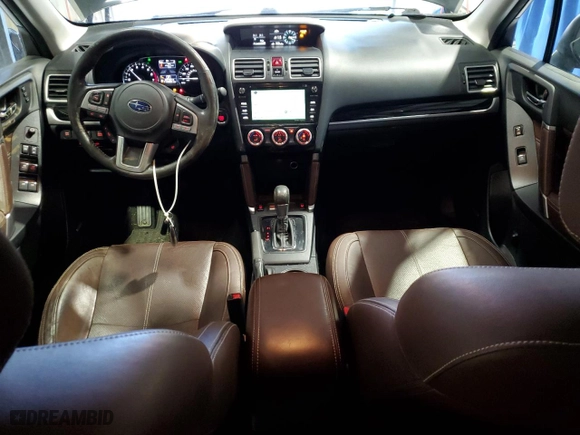 2017 Subaru Forester Touring with VIN JF2SJAWC8HH564037, listed as a Copart auction lot 87677265 with 114,986 mi miles and Salvage Title. Bid and sale history available at carsss.com. Image 8.