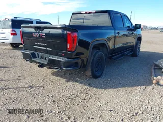 2021 GMC Sierra 1500 AT4 with VIN 1GTU9EETXMZ230606, listed as a IAAI auction lot 41599778 with 128,745 mi miles. Bid and sale history available at carsss.com. Image 4.