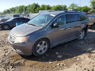 2012 Honda Odyssey Touring with VIN 5FNRL5H97CB005250, listed as a Copart auction lot 61420815 with 156,591 mi miles and Salvage title. Bid and sale history available at DreamBid. Image 1.