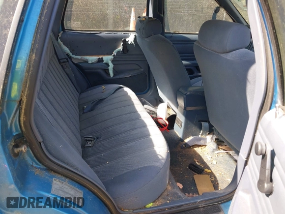 1992 Ford Tempo z VIN 1FAPP36U6NK188935, wystawiony jako IAAI lot #42133598 z przebiegiem 31 673 mil mil oraz . Historia ofert i sprzedaży dostępna na DreamBid. Obrazek 8.