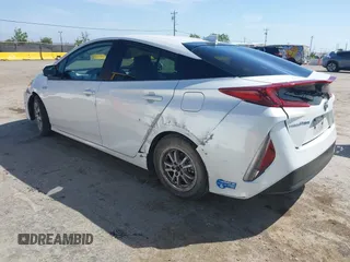2021 Toyota Prius LE with VIN JTDKAMFP2M3177459, listed as a IAAI auction lot 42093828 with 65,501 mi miles and . Bid and sale history available at DreamBid. Image 3.
