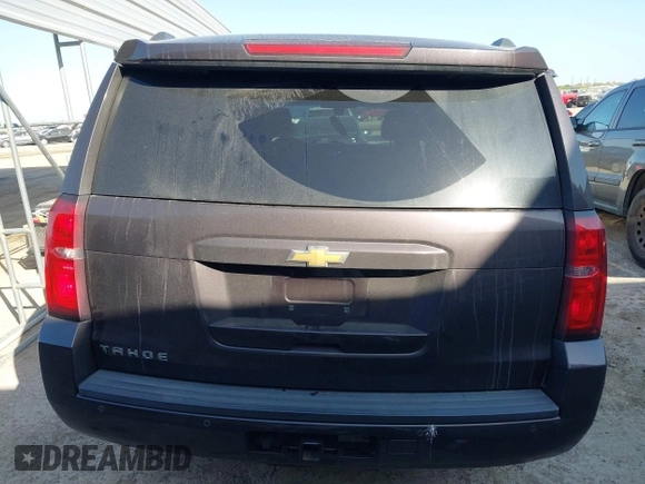2015 Chevrolet Tahoe LS with VIN 1GNSCAKCXFR628303, listed as a IAAI auction lot 42002698 with 152,141 mi miles and . Bid and sale history available at DreamBid. Image 16.