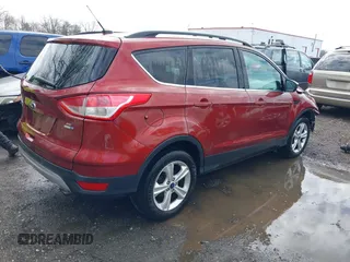 2016 Ford Escape SE with VIN 1FMCU9GXXGUB02932, listed as a IAAI auction lot 41797351 with 74,284 mi miles. Bid and sale history available at carsss.com. Image 4.