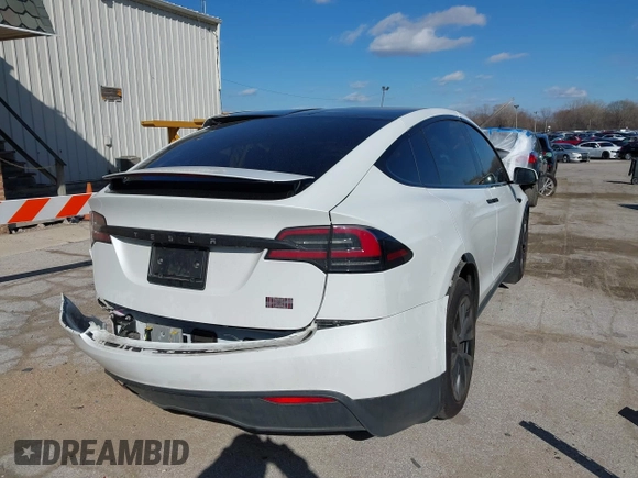 2023 Tesla Model X Plaid with VIN 7SAXCBE63PF405105, listed as a IAAI auction lot 41876918 with 22,475 mi miles and . Bid and sale history available at DreamBid. Image 4.