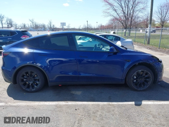 2022 Tesla Model Y Long Range with VIN 7SAYGDEE3NF449873, listed as a IAAI auction lot 41900271 with 38,571 mi miles and . Bid and sale history available at carsss.com. Image 13.
