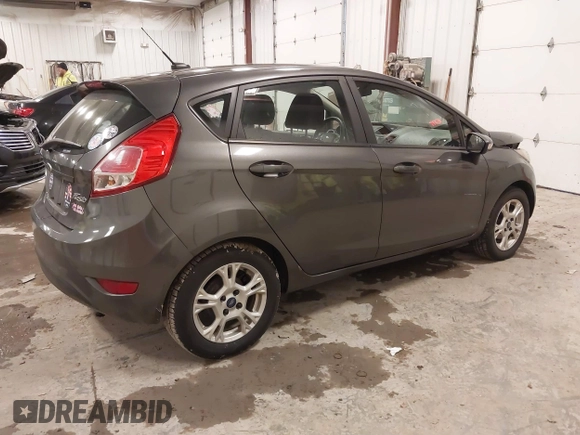 2015 Ford Fiesta SE z VIN 3FADP4EJ8FM138306, wystawiony jako IAAI lot #41227124 z przebiegiem 106 741 mil mil oraz . Historia ofert i sprzedaży dostępna na DreamBid. Obrazek 4.
