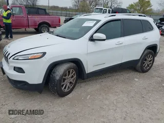 2014 Jeep Cherokee Latitude with VIN 1C4PJMCSXEW150735, listed as a IAAI auction lot 42020944 with 76,303 mi miles and . Bid and sale history available at carsss.com. Image 2.