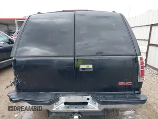 1998 GMC Yukon with VIN 1GKEC13R8WJ711255, listed as a IAAI auction lot 41457304 with 291,211 mi miles. Bid and sale history available at carsss.com. Image 16.