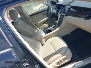 2014 Ford Taurus Limited z VIN 1FAHP2F85EG125118, wystawiony jako IAAI lot #42457437 z przebiegiem 129 406 mil mil oraz . Historia ofert i sprzedaży dostępna na DreamBid. Obrazek 5.