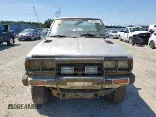 1981 Datsun 720 z VIN JN6MD02Y8BW002679, wystawiony jako Copart lot #54803875 z przebiegiem 109 018 mil mil oraz Tytuł czysty. Historia ofert i sprzedaży dostępna na DreamBid. Obrazek 5.