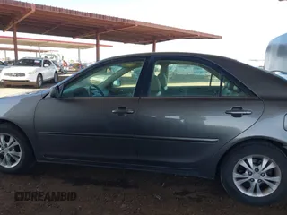 2006 Toyota Camry LE z VIN 4T1BF32K86U635925, wystawiony jako IAAI lot #42267547 z przebiegiem 162 593 mil mil oraz . Historia ofert i sprzedaży dostępna na DreamBid. Obrazek 14.