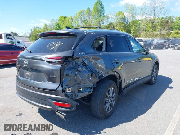 2021 Mazda CX-9 Touring with VIN JM3TCACY7M0503484, listed as a IAAI auction lot 42013262 with 63,777 mi miles and . Bid and sale history available at DreamBid. Image 4.