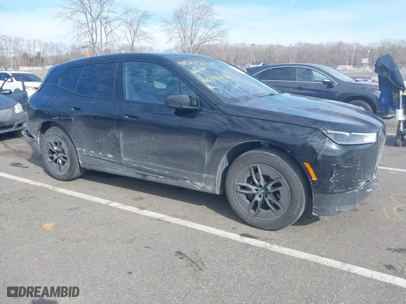 2023 BMW iX xDrive50 with VIN WB523CF02PCM45529, listed as a IAAI auction lot 41527811 with 33,429 mi miles. Bid and sale history available at carsss.com. Image 1.