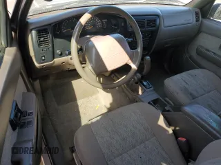 1999 Toyota Tacoma z VIN 4TAWN72N5XZ418522, wystawiony jako Copart lot #51940615 z przebiegiem 340 432 mil mil oraz Szkoda całkowita • Salvage title. Historia ofert i sprzedaży dostępna na DreamBid. Obrazek 8.