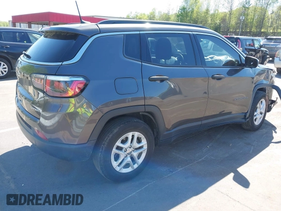 2019 Jeep Compass Sport with VIN 3C4NJCAB2KT613117, listed as a IAAI auction lot 41999519 with 73,734 mi miles and . Bid and sale history available at DreamBid. Image 4.