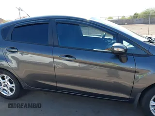 2015 Ford Fiesta SE z VIN 3FADP4EJ0FM146237, wystawiony jako IAAI lot #42452345 z przebiegiem 121 742 mil mil oraz . Historia ofert i sprzedaży dostępna na DreamBid. Obrazek 13.