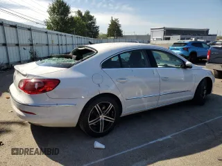 2012 Volkswagen CC Sport PZEV with VIN WVWMP7AN5CE521660, listed as a Copart auction lot 75190794 with 128,416 mi miles and Salvage Title. Bid and sale history available at carsss.com. Image 3.