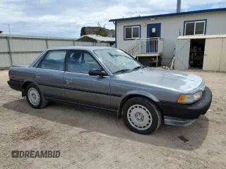 1990 Toyota Camry z VIN JT2VV21E2L0114723, wystawiony jako Copart lot #53584755 z przebiegiem 58 986 mil mil oraz Czysty tytuł • Clean title. Historia ofert i sprzedaży dostępna na DreamBid. Obrazek 4.