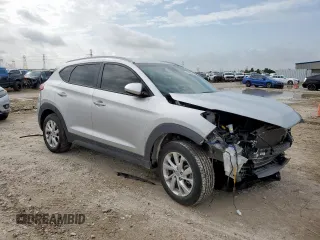 2019 Hyundai Tucson Value with VIN KM8J33A48KU962441, listed as a Copart auction lot 64451705 with 60,195 mi miles and Salvage title. Bid and sale history available at DreamBid. Image 4.