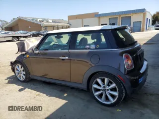 2010 MINI Hardtop with VIN WMWMF3C52ATZ62824, listed as a Copart auction lot 55175395 with 110,585 mi miles and Salvage Title. Bid and sale history available at DreamBid. Image 2.