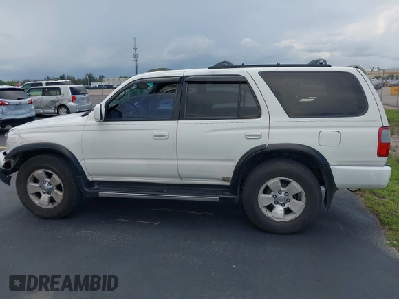 1998 Toyota 4Runner SR5 z VIN JT3GN86R5W0060650, wystawiony jako IAAI lot #42373192 z przebiegiem 264 886 mil mil oraz . Historia ofert i sprzedaży dostępna na DreamBid. Obrazek 15.