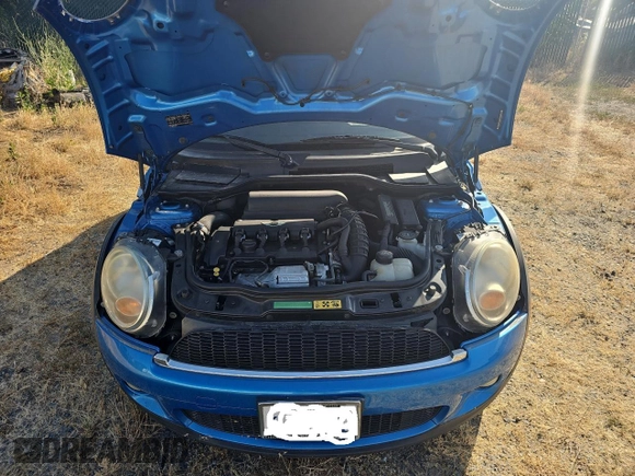 2009 MINI Hardtop S with VIN WMWMF73519TW86705, listed as a Copart auction lot 59819515 with 80,443 mi miles and Clean title. Bid and sale history available at DreamBid. Image 7.