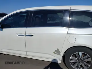 2014 Honda Odyssey Touring with VIN 5FNRL5H97EB037361, listed as a IAAI auction lot 42106742 with 198,279 mi miles and . Bid and sale history available at DreamBid. Image 14.
