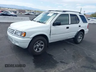 2001 Isuzu Rodeo S z VIN 4S2CK58W614329085, wystawiony jako IAAI lot #42303013 z przebiegiem 171 933 mil mil oraz . Historia ofert i sprzedaży dostępna na DreamBid. Obrazek 2.