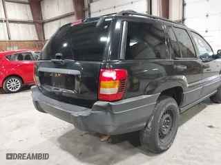2003 Jeep Grand Cherokee Laredo with VIN 1J4GW48S63C552366, listed as a IAAI auction lot 41861501 with 227,464 mi miles. Bid and sale history available at carsss.com. Image 14.