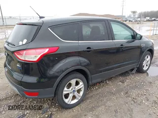 2013 Ford Escape SE with VIN 1FMCU9G94DUA21681, listed as a IAAI auction lot 42057896 with 197,257 mi miles. Bid and sale history available at carsss.com. Image 4.