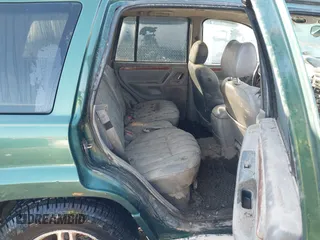 1999 Jeep Grand Cherokee Limited with VIN 1J4GW68S1XC555399, listed as a IAAI auction lot 41764099 with 1 mi miles. Bid and sale history available at carsss.com. Image 8.