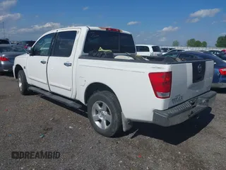 2004 Nissan Titan LE with VIN 1N6AA07A04N561241, listed as a IAAI auction lot 42180597 with 166,529 mi miles and . Bid and sale history available at DreamBid. Image 3.