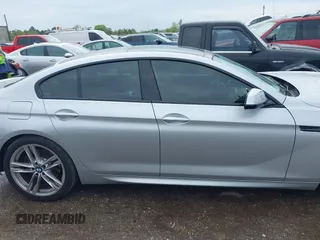 2015 BMW 6 Series 640i z VIN WBA6A0C51FD318982, wystawiony jako IAAI lot #41875547 z przebiegiem 60 968 mil mil oraz . Historia ofert i sprzedaży dostępna na DreamBid. Obrazek 13.