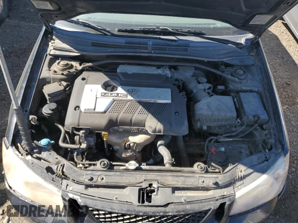 2005 Kia Spectra LX with VIN KNAFE121255156796, listed as a Copart auction lot 58595684 with 197,792 mi miles and Salvage Title. Bid and sale history available at carsss.com. Image 11.